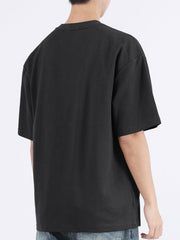 Black cotton crew neck t-shirt with half sleeves and a relaxed fit.