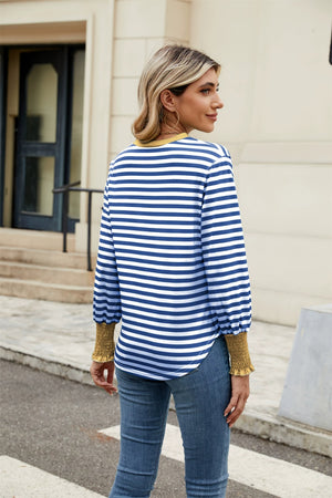 Striped long sleeve blouse with mustard cuffs and neckline.