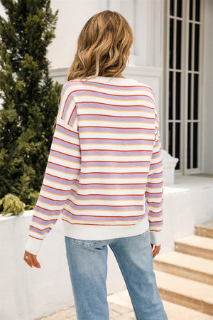Pastel stripe relaxed knit sweater with crew neck and long sleeves.