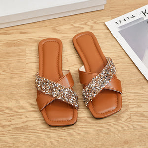 Light brown sequined crisscross open-toe sandals with a square toe.