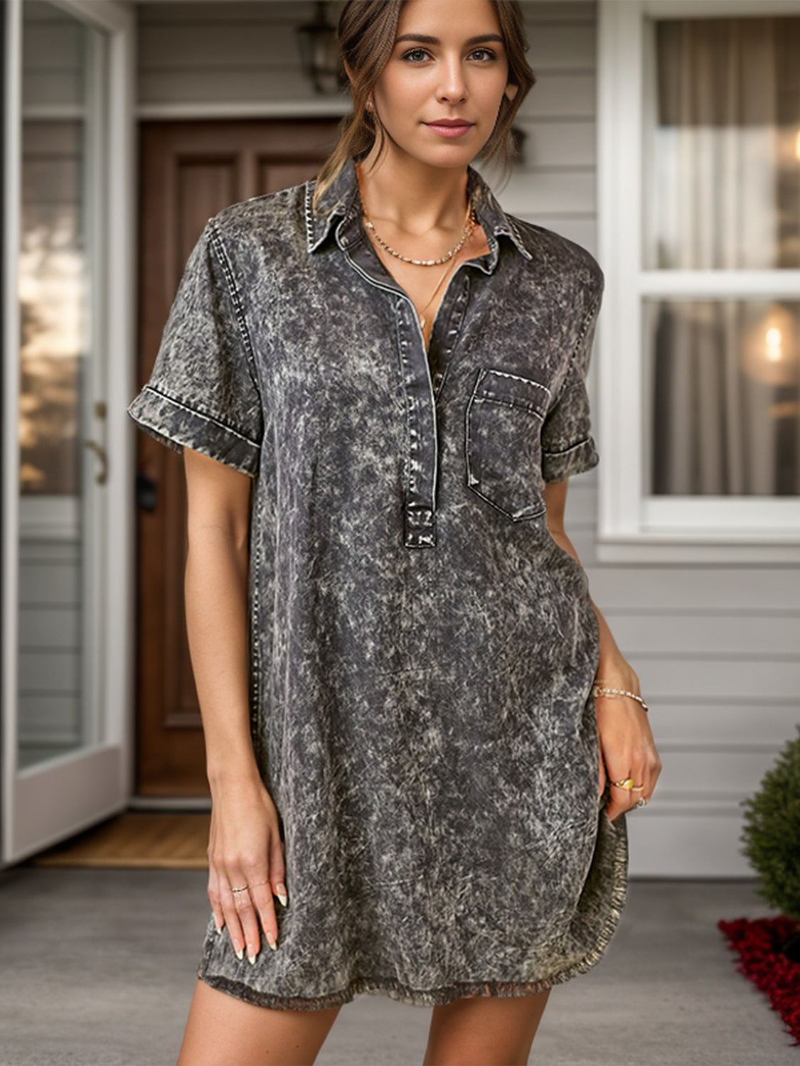 Acid wash shirtdress in black with contrast stitching, short sleeves, and a collared neckline.