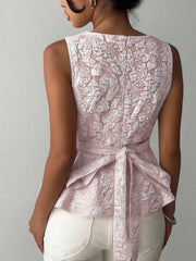 Textured floral peplum tank top in dusty pink with a boat neckline and tie waist detail.