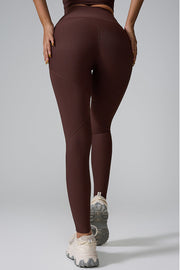 Brown ribbed contour leggings with diagonal seam detail.