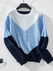 Chevron cable knit sweater in pastel blue and white with navy accents.