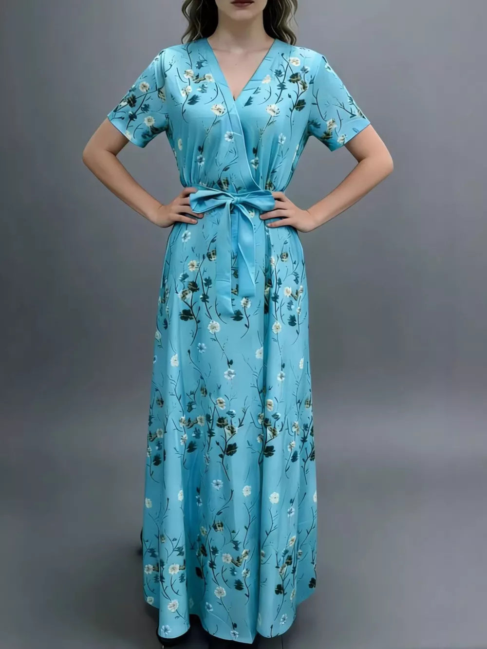 Blue floral wrap maxi dress with V-neck, short sleeves, and belted waist.