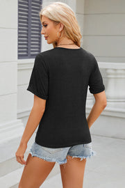 Asymmetric button-up tee in dark grey heather with short sleeves and a crew neck.