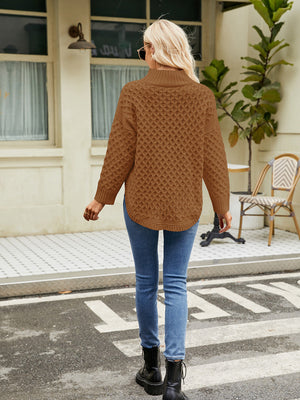 Caramel acrylic turtleneck sweater with diamond knit texture and curved hem.