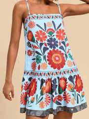 Light blue mini dress with vibrant floral print, square neckline, and tiered hem.