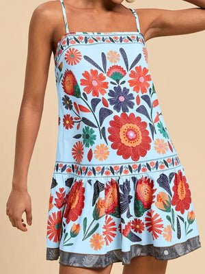 Light blue mini dress with vibrant floral print, square neckline, and tiered hem.