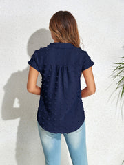 Dark blue textured dot poplin shirt with short sleeves and a collared neckline.