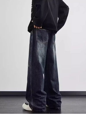 Distressed dark wash wide leg men's jeans with a relaxed fit and visible pocket details.