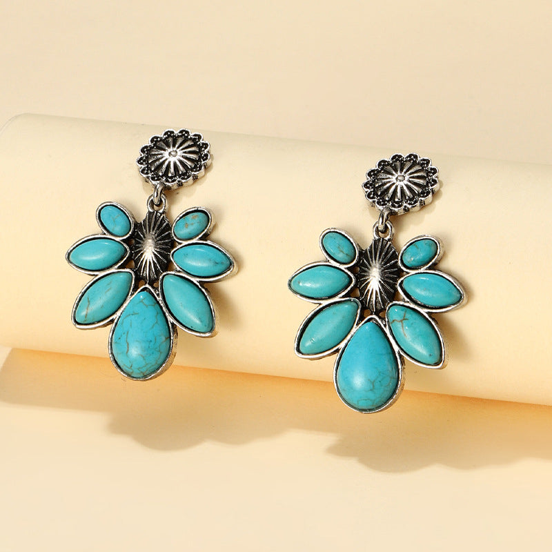 Teal floral petal drop earrings with silver alloy metal accents.