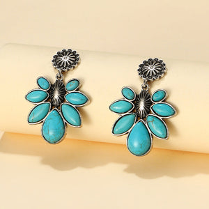 Teal floral petal drop earrings with silver alloy metal accents.