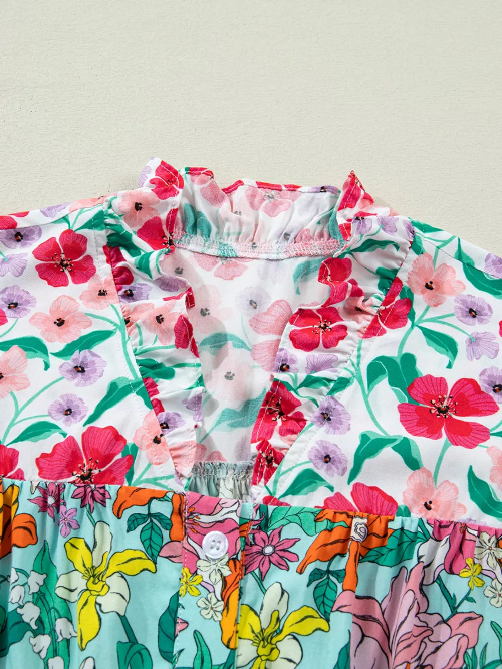 Vibrant floral print maternity overshirt with ruffled neckline and button front