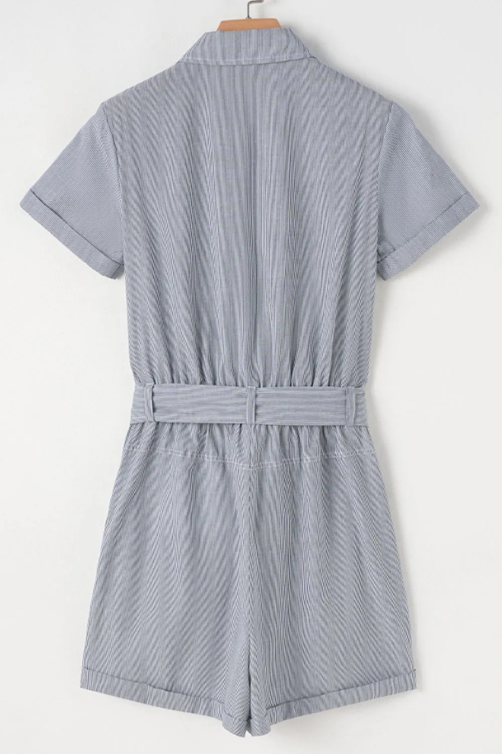 Pinstripe shirred waist romper with tie and cuffed shorts.