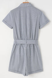 Pinstripe shirred waist romper with tie and cuffed shorts.