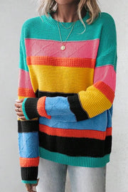 Rainbow stripe knit crewneck sweater with diamond pattern detail on sleeves.