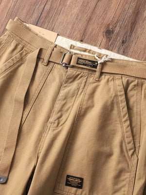 Tan cargo sweatpants with adjustable belt and pockets.