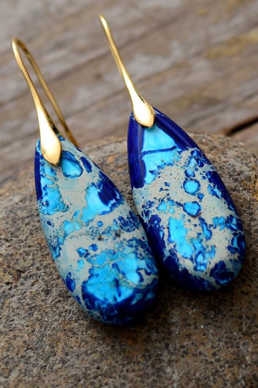 Ocean Jasper dangle earrings in blue/gold with teardrop stones and gold hooks.