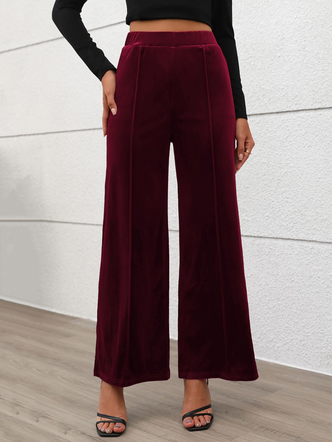 Velvet palazzo trousers in burgundy with seam details and a wide leg