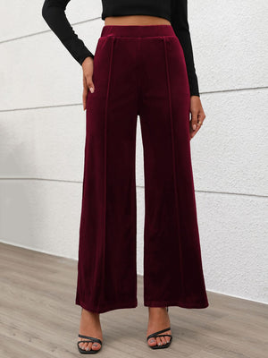 Velvet palazzo trousers in burgundy with seam details and a wide leg