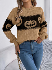 Camel intarsia knit sweater with jack-o'-lantern pattern, crew neck, and long sleeves.