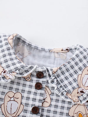 Toddler dress with teddy bear print, gingham pattern, button-down front, and ruffled collar.