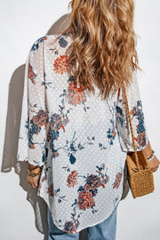 White floral dotted kimono cover-up with bell sleeves and a flowy hem.