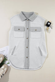 Light gray cotton utility vest with contrast trim, button-down front, and chest pockets.