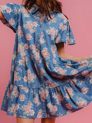 Light blue floral denim mini dress with ruffled tiers and short sleeves.