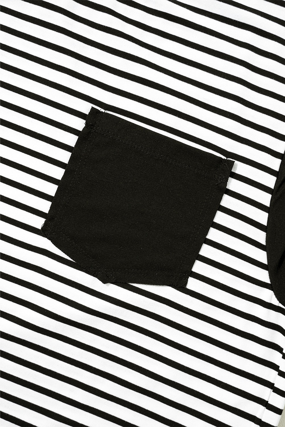 Black and white striped t-shirt with a black chest pocket detail.