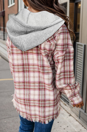 Hooded plaid shacket in blush pink with a frayed hem and grey hood.