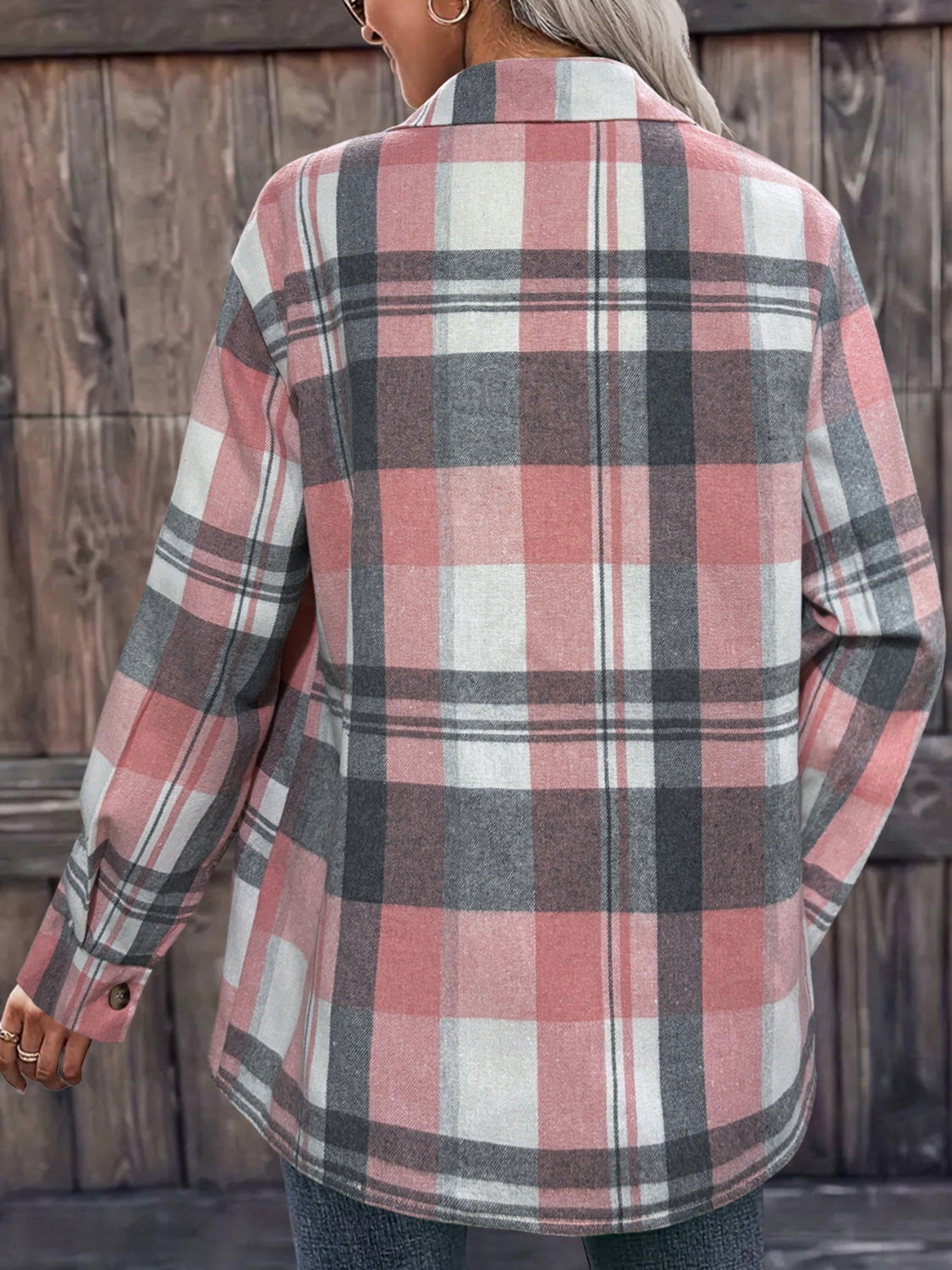 Oversized plaid shirt jacket in dusty pink with relaxed fit and buttoned cuffs.