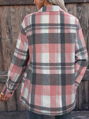Oversized plaid shirt jacket in dusty pink with relaxed fit and buttoned cuffs.