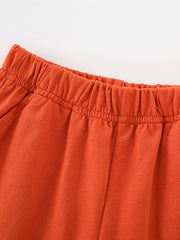 Toddler orange cotton shorts with elastic waistband detail