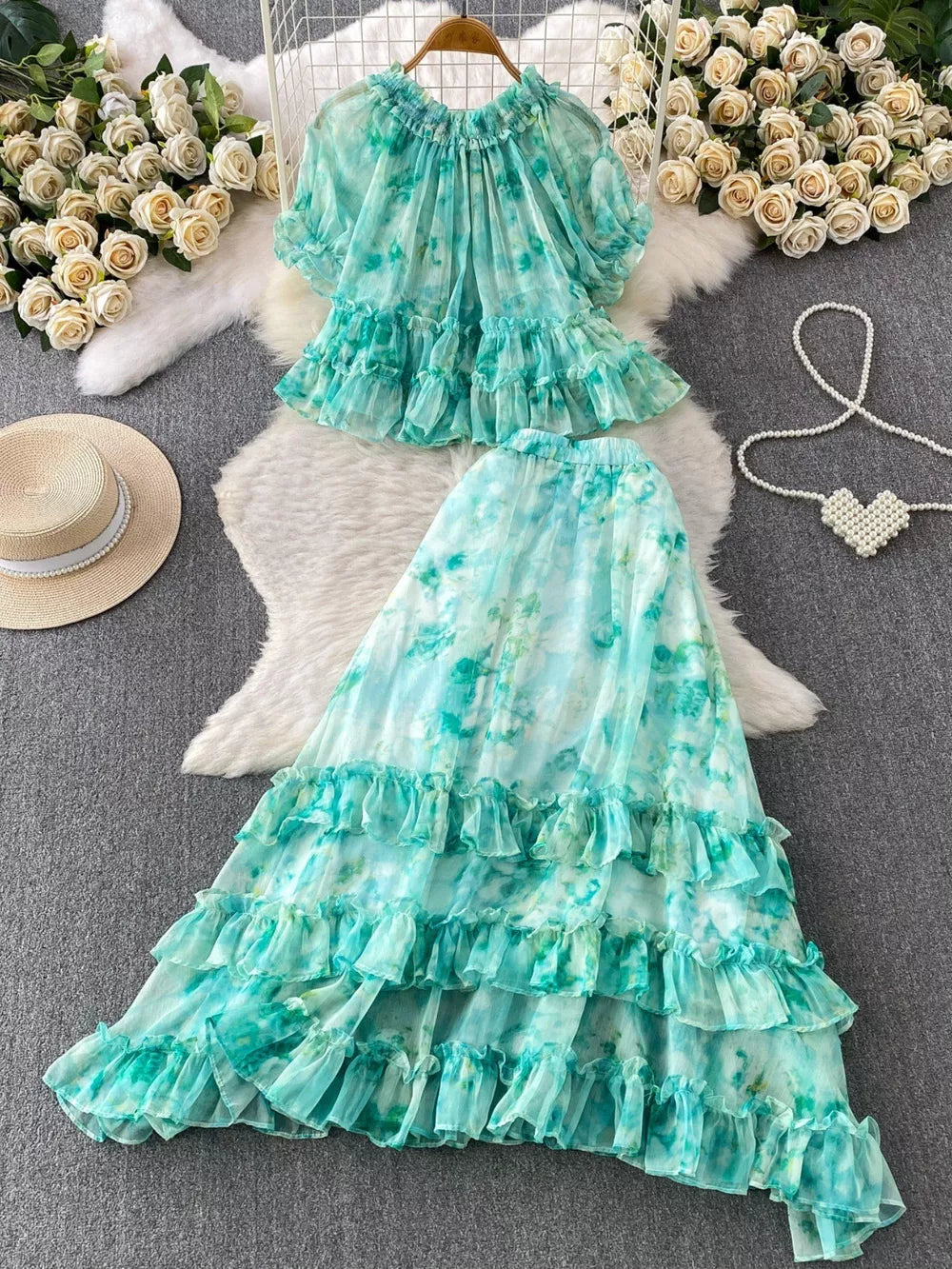 Light green floral ruffle set with bow detail, featuring a crop top and tiered maxi skirt.