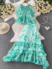 Light green floral ruffle set with bow detail, featuring a crop top and tiered maxi skirt.