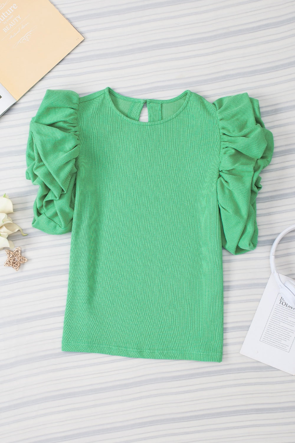 Light green ribbed short sleeve top with gathered puff sleeves and keyhole back.