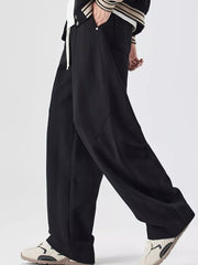 Black jogger pants with drawstring and pockets, relaxed fit.