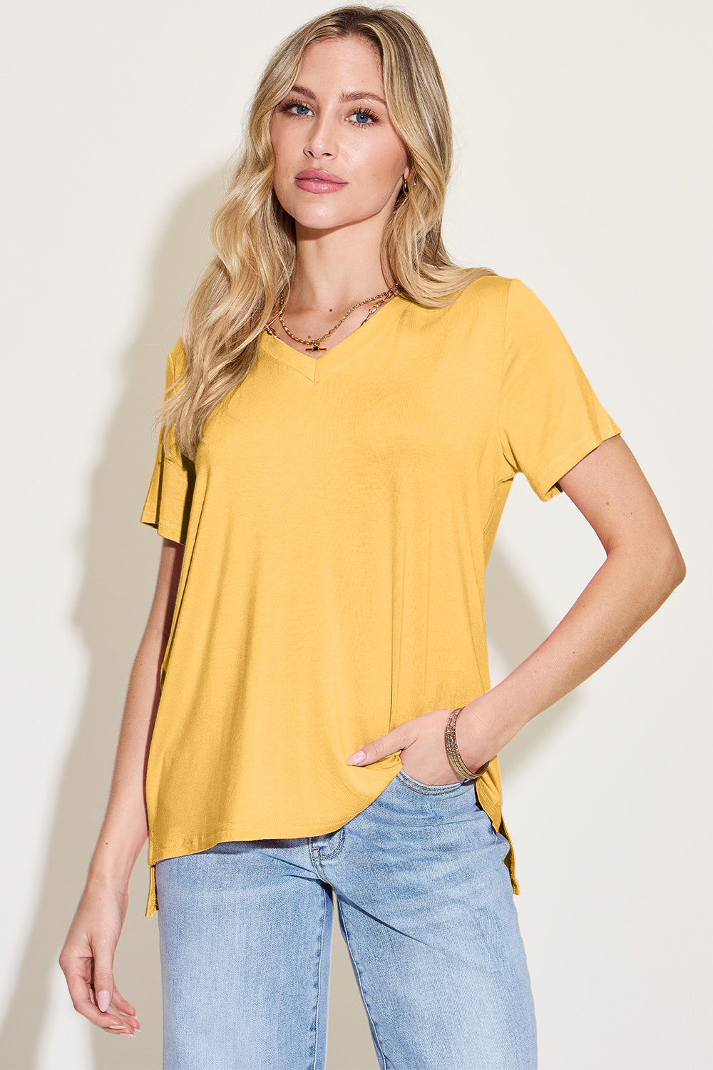 Yellow bamboo v-neck t-shirt with short sleeves and asymmetric hemline