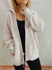 Speckled knit relaxed zip-up hoodie in blush pink with a full zip and ribbed cuffs.