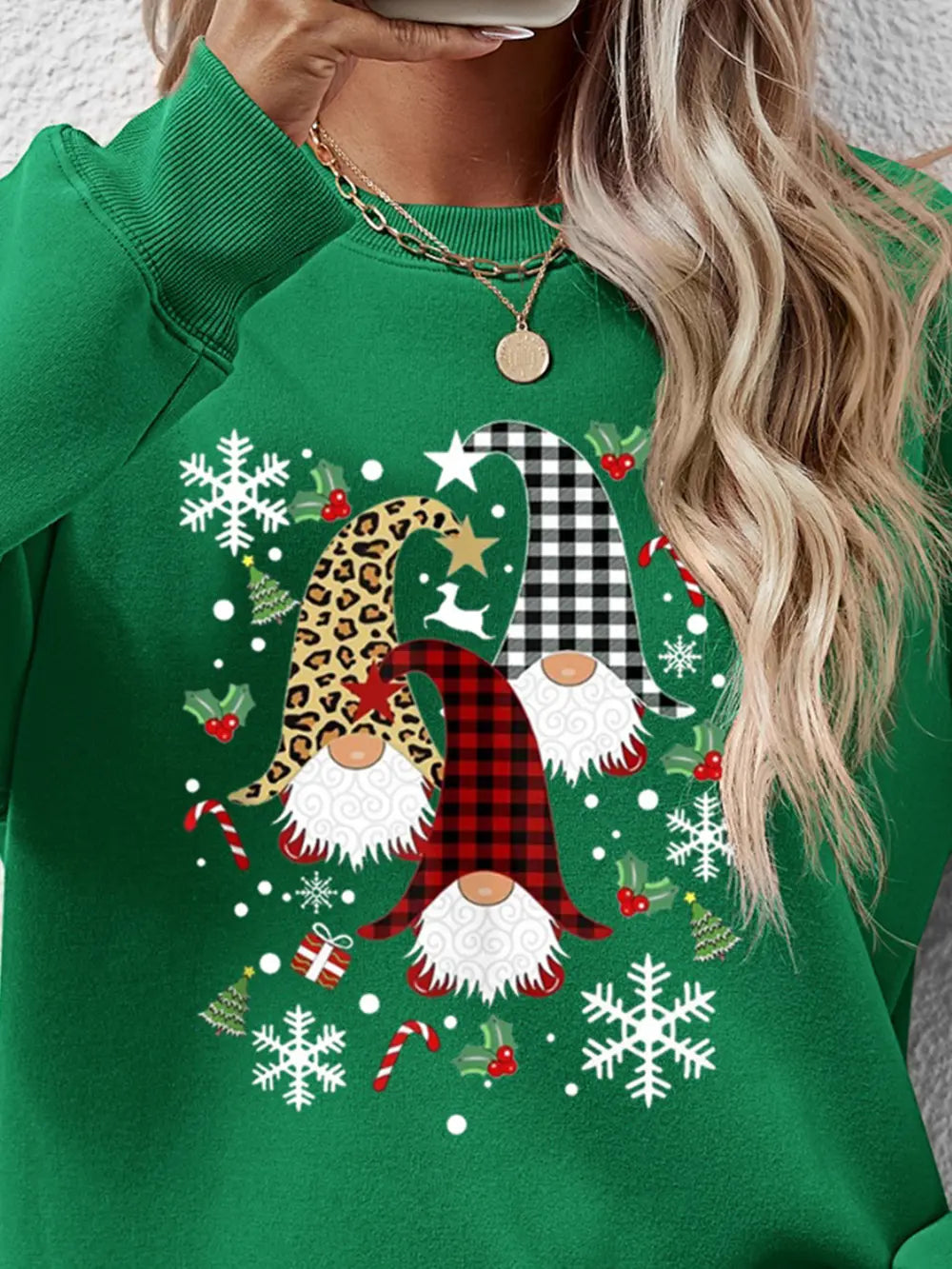 Green raglan sweatshirt with festive gnome graphic and snowflakes.
