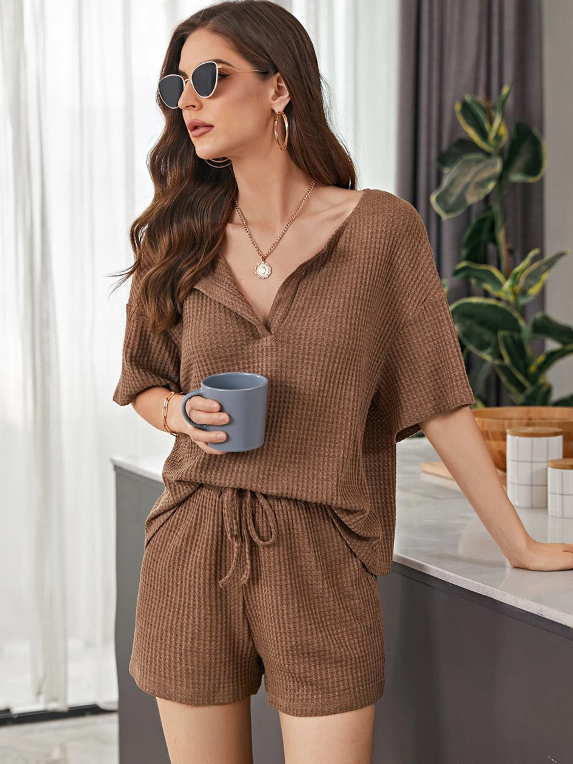 Brown waffle knit henley short set with v-neck and drawstring shorts.