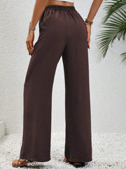 Textured palazzo trousers in dark brown with a drawstring waist and wide legs.