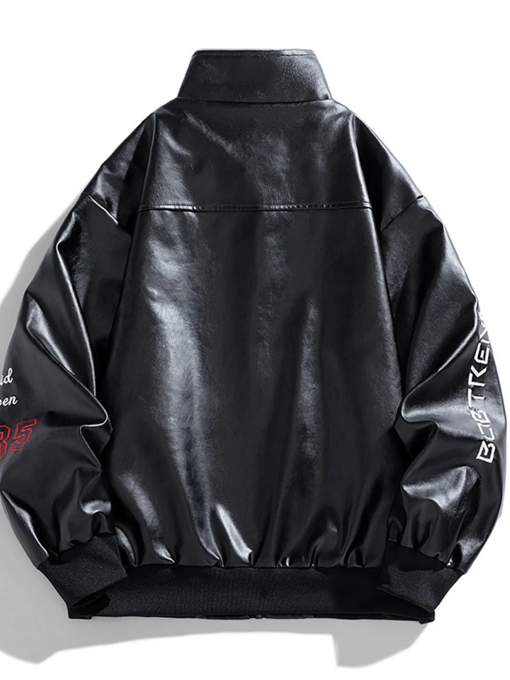 Black faux leather bomber jacket with embroidered details on sleeves and collar.