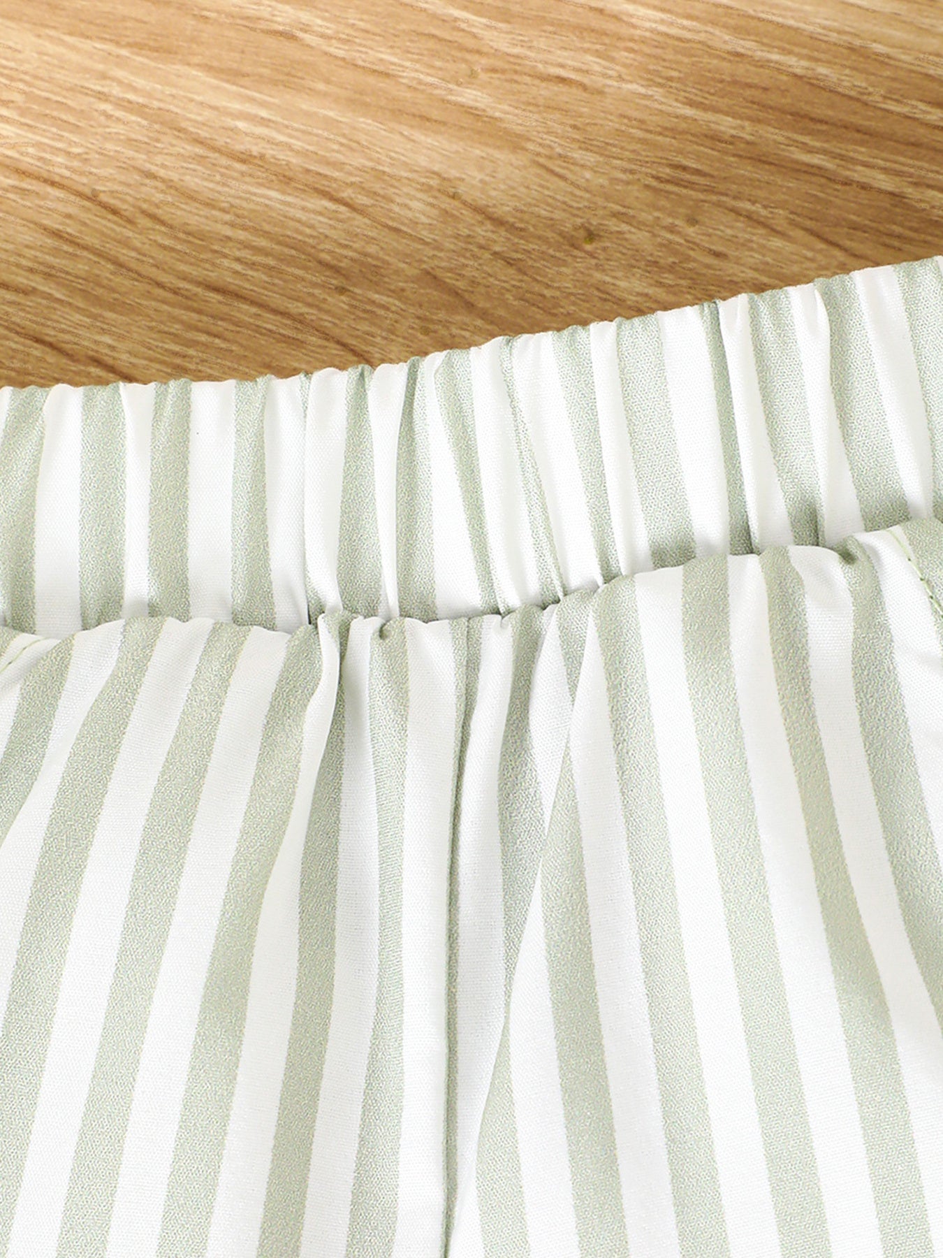 Baby girls' light green striped cotton shorts with elastic waistband