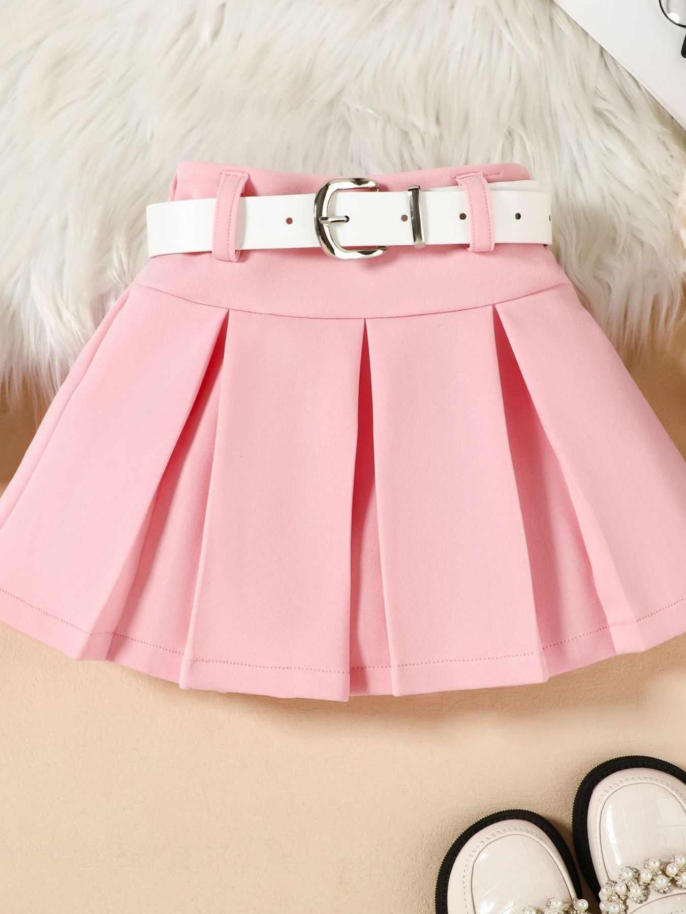 Pink toddler skirt with white belt and pleats