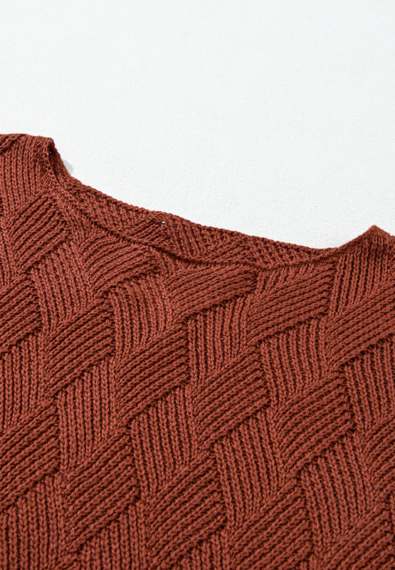Textured diamond knit sweater in rust acrylic with a relaxed fit and crew neck.