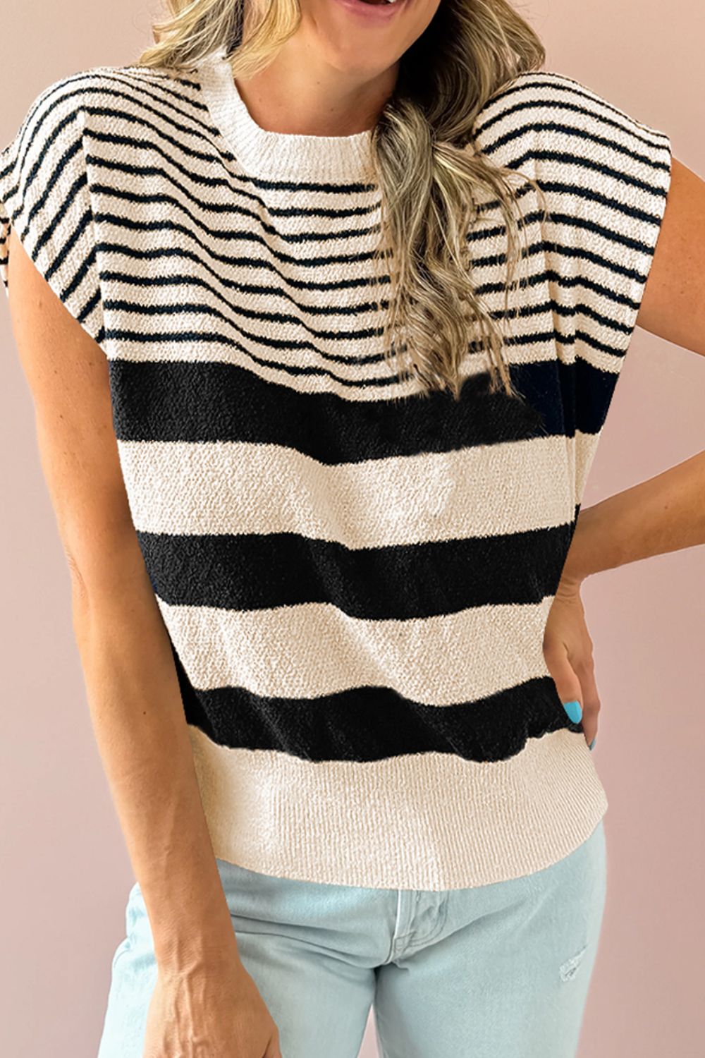 Textured stripe knit sleeveless top in black and cream with a crew neck.