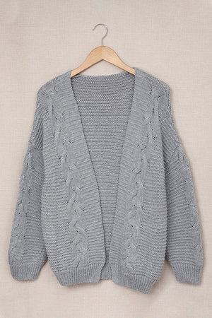 Gray acrylic cable knit open-front cocoon cardigan with wide sleeves and ribbed trim.